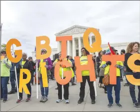  ?? AP/MANUEL BALCE CENETA ?? Gay-rights advocates rally Tuesday in front of the Supreme Court building.