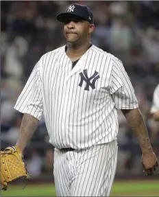  ??  ?? New York Yankees starting pitcher CC Sabathia walks off the field at the end of the third inning of Game 4 of baseball’s American League Division Series against the Boston Red Sox, on Tuesday, in New York. AP PHOTO/FRANK FRANKLIN II