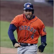  ?? GREGORY BULL — THE ASSOCIATED PRESS ?? George Springer reacts after scoring against the Tampa Bay Rays during Game 6 the ALCS.