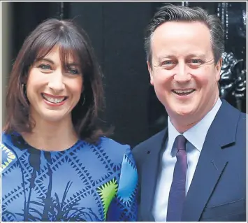  ??  ?? Prime Minister David Cameron is all smiles with wife Sam after his election win