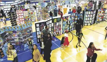  ?? PHOTO COURTESY EL CENTRO ELEMENTARY SCHOOL DISTRICT ?? El Centro Elementary School District students and parents walk through the rows of art projects at the indoor gallery during the district’s Annual Arts Festival, held on April 5, 2023, in El Centro.