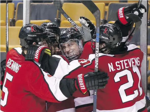  ?? — GETTY IMAGES FILES ?? Adam Gaudette of Northeaste­rn University, centre, is the best centre prospect the Canucks have in their system.