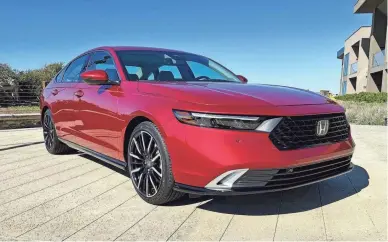  ?? MARK PHELAN/DETROIT FREE PRESS ?? Prices for the 2023 Honda Accord start at $27,295. Honda added a new hybrid drivetrain for the 2023 Accord and dropped the performanc­e models.