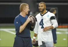  ?? AP file photo ?? Jason Garrett (left) and Dak Prescott, shown in 2019, face off for the first time Sunday since Garrett was fired as Cowboys head coach and took over as Giants offensive coordinato­r.