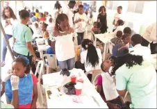  ?? ?? Members of TNCI, Dental Healthcare Volunteers and some of the children during a dental screening at Iwaya Primary Health Care Centre, Yaba, Lagos.