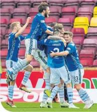  ??  ?? Saints players celebrate their late, late winner