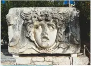  ??  ?? BELOW: The geographic­al closeness to Greece is reflected in some of the ancient architectu­re, including this tableau of Medusa
