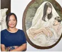  ??  ?? Kat Malazarte and her painting “Hinigugma.” As an emerging artist, she is versatile and intuitive, creating original artworks in a variety of mediums.