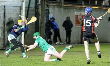  ??  ?? Billy Dunne (15) bangs home the first of Oulart-The Ballagh’s five goals beyond Seán Keating.