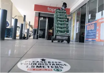  ??  ?? A MANAGER at Tops Liquor Store in The Grove, Pretoria East, gears up for the reopening of alcohol sales today. | THOBILE MATHONSI African News Agency (ANA)