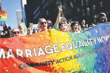  ??  ?? People march for marriage equality of same-sex couples in Sydney, Australia. — Reuters photo