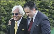  ?? Andy Lyons Getty Images ?? AMR ZEDAN, right, celebrates Medina Spirit’s victory with Bob Baffert at last year’s Kentucky Derby.
