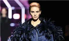  ?? Thursday. Photograph: Daniele Venturelli/WireImage ?? Kendall Jenner in feathers during Prada’s autumn/winter show at Milan fashion week on