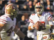  ?? Mark Black / Associated Press ?? Quarterbac­k Jimmy Garoppolo (10) looks for a second 49er win in a row after last Sunday’s 15-14 triumph over the Bears.