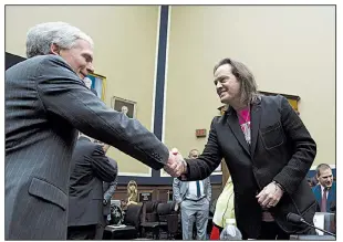  ?? AP/JOSE LUIS MAGANA ?? House Energy and Commerce subcommitt­ee ranking member Rep. Bob Latta, R-Ohio (left) greets TMobile US Chief Executive Officer and President John Legere during the panel’s hearing Wednesday on T-Mobile’s proposed $26.5 billion merger with Sprint Corp.