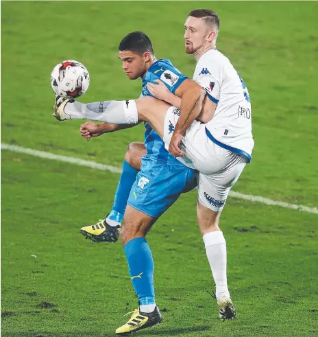  ?? Picture: GETTY IMAGES ?? Gold Coast City’s Jarrod Kyle (left) under pressure from Luke Adams, of South Melbourne, last night.