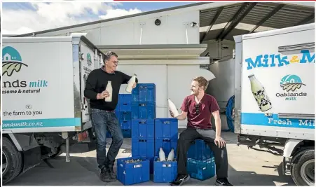  ??  ?? Above, Oaklands milk farmer Julian Raine, with glass bottled milk delivered by contractor Bill Stansbury. Left, Takaka’s Village Milk managing director, Richard Houston, with one of his raw milk automatic dispensers which satisfies a niche