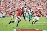  ?? [PHOTO BY BRYAN TERRY, THE OKLAHOMAN] ?? Oklahoma’s CeeDee Lamb scores a touchdown during Saturday’s game against Baylor at Gaylord Family-Oklahoma Memorial Stadium.