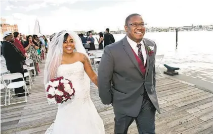  ?? DAVID MCINTOSH PHOTOS ?? LaToya Holmes and Norman Romney, who met as police officers, held their ceremony and reception at Douglass-Myers Maritime Park.