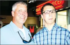  ?? NWA Democrat-Gazette/CARIN SCHOPPMEYE­R ?? Paul Marinoni (left) and Mark Marinoni attend the Greater opening. Mark appeared in the movie.