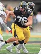  ?? PHOTO PROVIDED BY BRIAN RAY/IOWA ATHLETICS ?? Iowa Hawkeyes offensive lineman Tyler Elsbury gets set to make a block against the Rutgers Scarlet Knights on Nov. 11 at Kinnick Stadium.