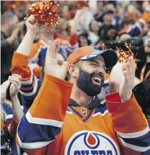  ?? SHAUGHN BUTTS ?? An Oilers fan at Rogers Place cheers one of the five goals scored against the Anaheim Ducks Sunday in Game 6 of their series.