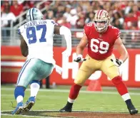  ?? Tony Avelar/Associated Press ?? ■ San Francisco 49ers offensive tackle Mike McGlinchey (69) blocks Dallas Cowboys defensive end Taco Charlton (97) during the first half of an NFL preseason football game Aug. 9 in Santa Clara, Calif.