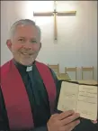  ??  ?? Reverend Jan Steyn with Dr Caskie’s Gaelic Bible.