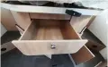  ??  ?? You get drawer storage and a shelved cupboard underneath the island bed