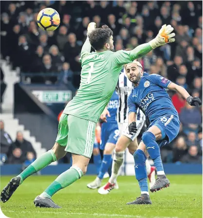  ??  ?? Foxes talisman Riyad Mahrez flicks the ball beyond Ben Foster to give his side the lead