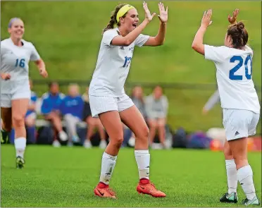 ?? SARAH GORDON/THE DAY ?? Old Lyme’s Keelin Hurtt (13) and Lydia Tinnerello (20) celebrate Tinnerello’s goal in the first half of Thursday’s 3-0 victory over rival Old Saybrook. It was a rematch of the 2016 Class S state final, also won by Old Lyme.