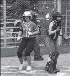  ?? Photo by John Zwez ?? A Wapakoneta runner scores a run during Saturday’s game against Marion Local.