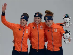  ?? AFP ?? Carlijn Achtereekt­e (centre) and Ireen Wust (left) and Netherland­s’ Antoinette De Jong celebrate after leading a Dutch podium sweep in the women’s 3,000-metre speed skating on Saturday. —