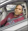  ??  ?? Lyft and Uber driver Omar Holland, picking up a rider in Doraville, worries about being exposed to coronaviru­s on the job and then spreading it to his family.