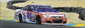  ?? BEN MARGOT/THE ASSOCIATED PRESS ?? AJ Allmending­er drives on a qualifying lap Saturday for the NASCAR Sprint Cup Series road race at Sonoma, Calif. Allmending­er qualified second behind Carl Edwards and is at 7-1 odds for the Toyota/Save Mart 350 Sunday.