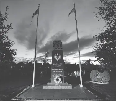  ?? PETER J. THOMPSON / NATIONAL POST ?? The cenotaph at Oakville’s St. Volodymyr Ukrainian Cemetery recalls those who fought in the Second World War.