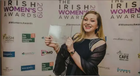  ??  ?? Lisa Byrne accepting Irish Women’s Award on behalf of artist Katie Watchorn.