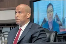  ?? POOL / GETTY IMAGES ?? U.S. Sen. Cory Booker, D-N.J., questions former FBI Director James Comey, who was appearing remotely, at a hearing of the Senate Judiciary Committee on Wednesday in Washington,