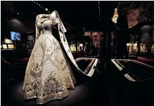  ?? ?? QUEEN Elizabeth II’S 1953 coronation dress and robe are on display at the exhibition at Buckingham Palace in central London. | AP