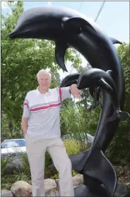  ?? GARY NYLANDER/The Daily Courier ?? Bob Dow Reid stands in front of his Harmony sculpture in East Kelowna on Thursday. After being refinished for the outdoors, the sculpture will be installed by the front entrance of the Dolphins highrise on Sunset Drive.