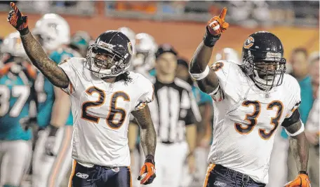  ?? | AP ?? Cornerback­s Tim Jennings (left) and Charles Tillman will be back, but the Bears might seek help at the position in a draft that features several players with size and potential.