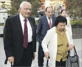  ?? Rich Pedroncell­i Associated Press ?? BABULAL BERA, father of Rep. Ami Bera (D-Elk Grove), walks to the federal courthouse in Sacramento. Defense attorneys said his sentence was too severe.