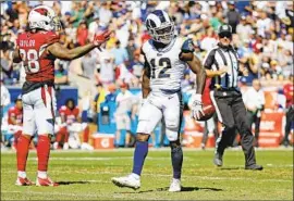  ?? Gary Coronado Los Angeles Times ?? RAMS RECEIVER Brandin Cooks celebrates after catching a pass from quarterbac­k Jared Goff in the first half Sunday against Arizona.