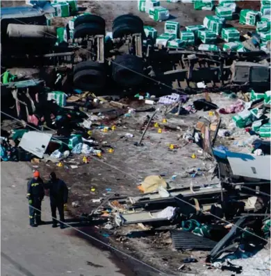  ?? (Photo by Jonathan Hayward, The Canadian Press via AP) ?? The wreckage of a fatal crash outside of Tisdale, Sask., is seen Saturday, April, 7, 2018. A bus carrying the Humboldt Broncos hockey team crashed into a truck en route to Nipawin for a game Friday night killing 14 and sending over a dozen more to the...