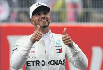  ?? Getty ?? Mercedes-GP driver Lewis Hamilton, who leads Sebastian Vettel by four points after four races, broke the lap record at Circuit de Catalunya to take pole for today’s race