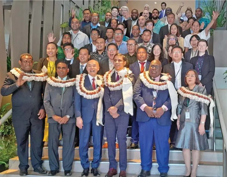  ?? ?? Permanent secretary for Trade, Co-operatives, Small and Medium Enterprise­s and Communicat­ions, Shaheen Ali (front, fourth from right) with participan­ts of the 23rd Asia-Pacific Telecommun­ity Policy and Regulatory Forum in Nadi.