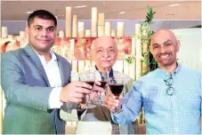  ?? President Hiro Asandas (Center); Managing Director Ravi Daryanani and Sales & Marketing Director Chand Daryanani toast to Canadian’s commitment to sustainabl­e lifestyle in celebratio­n of their 60years in providing quality linen. ??