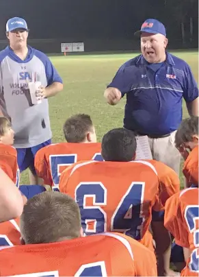  ?? (Photo by Ryan Phillips, SDN) ?? Starkville Academy junior varsity football coach Sam Wright talks to his team following a 42-0 victory over Magnolia Heights School on Thursday