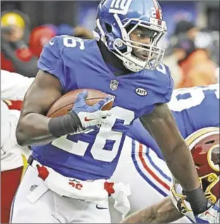  ??  ?? Orleans Darkwa rushes for career-high 154 yards in Giants finale.