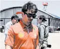  ?? PHOTOS: AFP ?? Ferrari’s Monegasque driver Charles Leclerc walks in the paddock while arriving for a press conference at the Shanghai Internatio­nal circuit ahead of the Formula One Chinese Grand Prix in Shanghai yesterday.